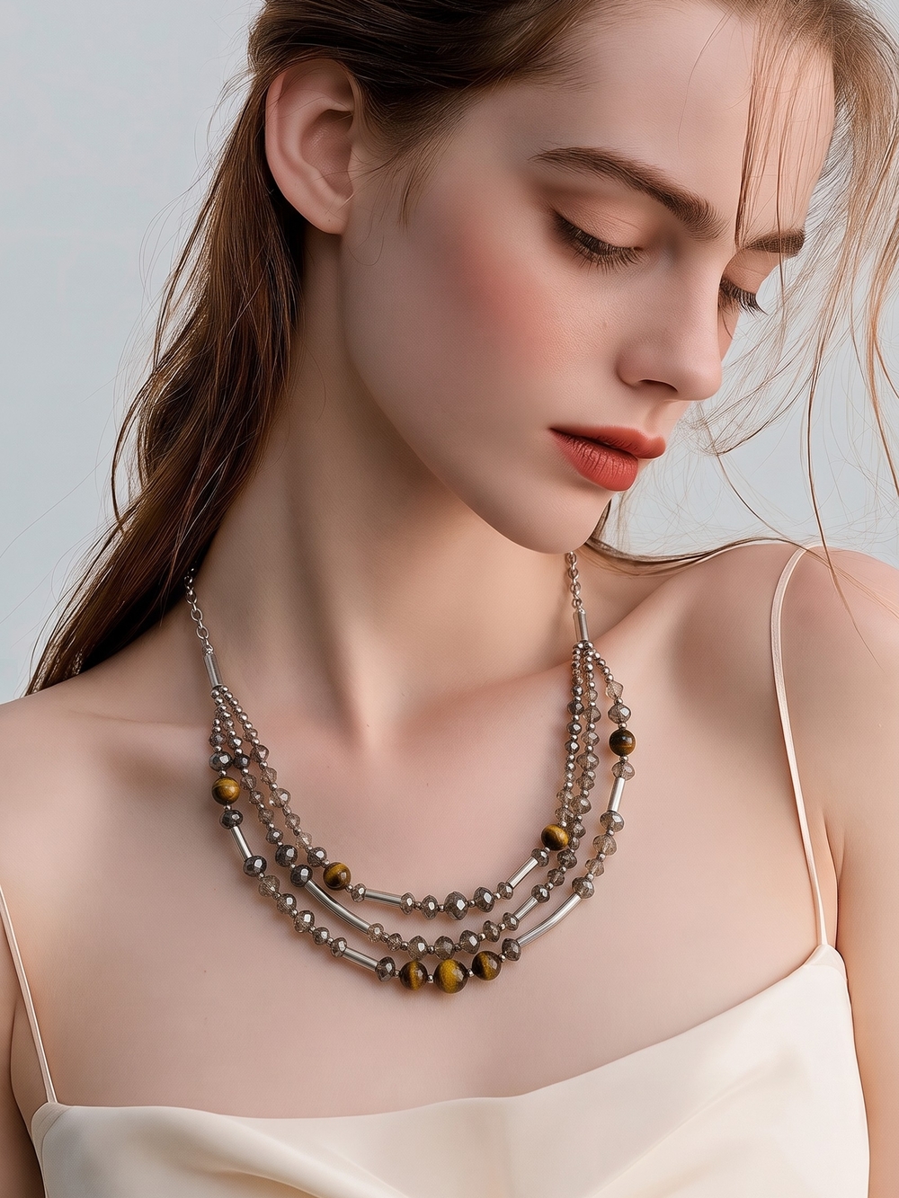 Lia Sophia layered necklace featuring silver-tone beads and brown tiger's eye